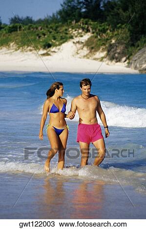 Side view of a couple in swimsuits, Horse-shoe Bay beach, Bermuda View Large Photo Image Stock Image - Side view of a couple in swimsuits, Horse-shoe Bay beach, Bermuda. Fotosearch