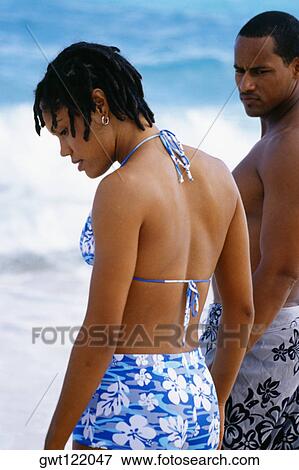 Side view of a couple in swimsuits, Horse-shoe Bay beach, Bermuda View Large Photo Image Stock Photo - Side view of a couple in swimsuits, Horse-shoe Bay beach, Bermuda. Fotosearch