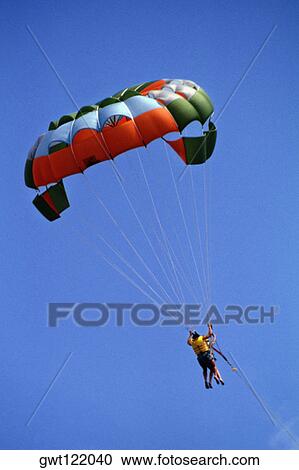 Two people parasailing, Crystal Palace Hotel, Nassau, Bahamas View Large Photo Image Stock Image - Two people parasailing, Crystal Palace Hotel, Nassau, Bahamas. Fotosearch