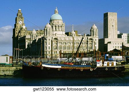 A barge docked beside a domed building and a clock tower, Liverpool, England View Large Photo Image Stock Photography - A barge docked beside a domed building and a clock tower, Liverpool, England. Fotosearch