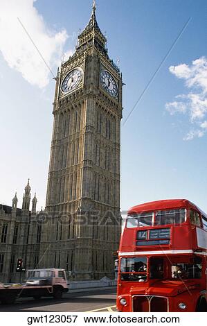 A bus seen passing by Big Ben, London, England View Large Photo Image Stock Photo - A bus seen passing by Big Ben, London, England. Fotosearch
