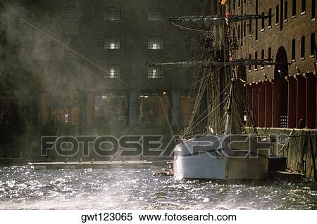 A ship docked at a shipping warehouse, Liverpool, England View Large Photo Image Stock Photography - A ship docked at a shipping warehouse, Liverpool, England. Fotosearch