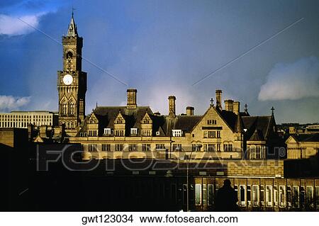 Front view of a clock tower on a cloudy day, Bradford, England View Large Photo Image Picture - Front view of a clock tower on a cloudy day, Bradford, England. Fotosearch