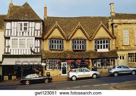 Stock Image - Front view of row houses, Burford, England. Fotosearch