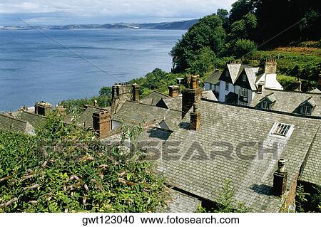 Stock Image - Rooftops of Clovelly with the sea in the background, England. Fotosearch