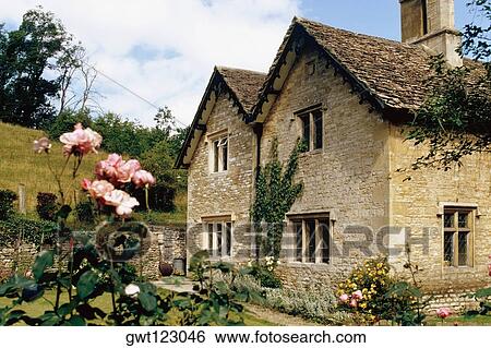 Side view of a cottage with a garden in its front, Castle Combe, England View Large Photo Image Stock Photograph - Side view of a cottage with a garden in its front, Castle Combe, England. Fotosearch
