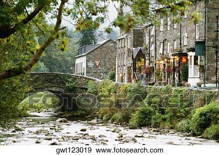 Side view of a stone bridge and shops in Beddgeurant, Wales View Large Photo Image Stock Photo - Side view of a stone bridge and shops in Beddgeurant, Wales. Fotosearch