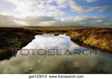 Sky reflecting in the Lochan Isle of Harris & Lewis in Scotland View Large Photo Image Picture - Sky reflecting in the Lochan Isle of Harris & Lewis in Scotland. Fotosearch