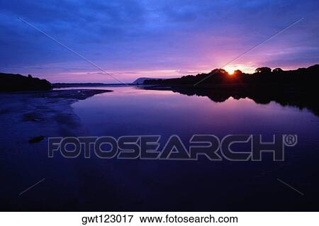 Stock Photo - Sunset over Newport Estuary in Pembrokeshire, Wales. Fotosearch