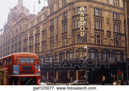 View of Harrods with a red bus seen passing by, London, England View Large Photo Image Stock Photo - View of Harrods with a red bus seen passing by, London, England. Fotosearch