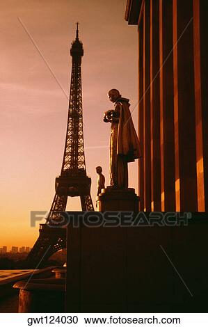 Eiffel Tower seen at the back of a palace statue at sunset, Paris, France View Large Photo Image Stock Image - Eiffel Tower seen at the back of a palace statue at sunset, Paris, France. Fotosearch