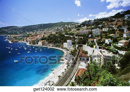 Stock Image - High angle view of a city and a beach, Ville Frenche, France. Fotosearch