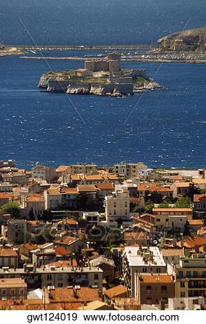 Stock Photo - High angle view of a modern city and Chateau D'IF, Marseille, France. Fotosearch