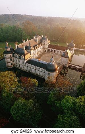 High angle view of Tanlay Chateau surrounded by trees, Burgundy, France View Large Photo Image Stock Photograph - High angle view of Tanlay Chateau surrounded by trees, Burgundy, France. Fotosearch