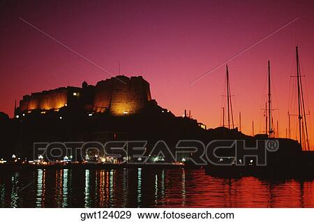 Scenic view of a fortress and a harbor at night, Bonifacio, Corsica, France View Large Photo Image Stock Photo - Scenic view of a fortress and a harbor at night, Bonifacio, Corsica, France. Fotosearch