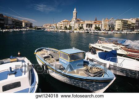 Side view of boats anchored at a harbor, Sete, France View Large Photo Image Stock Photo - Side view of boats anchored at a harbor, Sete, France. Fotosearch
