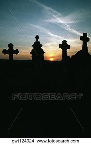 Silhouette of gravestones at sunset, Burgundy, France View Large Photo Image Picture - Silhouette of gravestones at sunset, Burgundy, France. Fotosearch