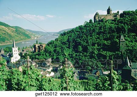 Stock Image - High angle of houses and lush foliage, Bacharach, Rhine River, Germany. Fotosearch