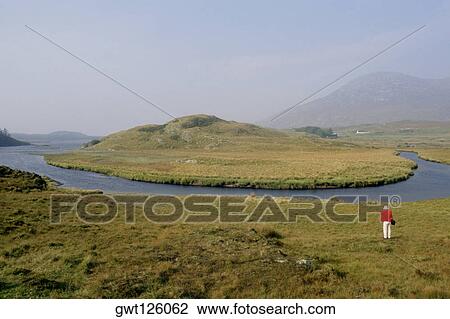 Man standing on a landscape, County Galway, Republic of Ireland View Large Photo Image Stock Image - Man standing on a landscape, County Galway, Republic of Ireland. Fotosearch