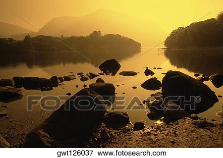 Rocks in a lake, Lake Killarney, County Kerry, Republic of Ireland View Large Photo Image Stock Photo - Rocks in a lake, Lake Killarney, County Kerry, Republic of Ireland. Fotosearch