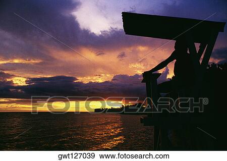 A beautiful sunset at a beach on Hedonism 2 Resort, Jamaica View Large Photo Image Stock Photo - A beautiful sunset at a beach on Hedonism 2 Resort, Jamaica. Fotosearch
