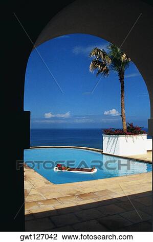 A woman is relaxing on a float in a swimming pool, Destiny Villa, Jamaica View Large Photo Image Stock Image - A woman is relaxing on a float in a swimming pool, Destiny Villa, Jamaica. Fotosearch