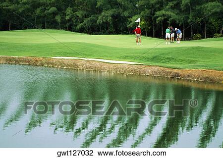 Golfers are seen on a golf course at Wyndham Resort, Jamaica View Large Photo Image Stock Image - Golfers are seen on a golf course at Wyndham Resort, Jamaica. Fotosearch