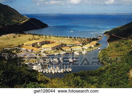 A fleet of ships anchored at a harbor, St. Maarten, Caribbean. View Large Photo Image Picture - A fleet of ships anchored at a harbor, St. Maarten, Caribbean.. Fotosearch
