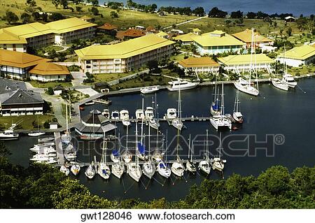 A fleet of ships anchored at a harbor, St. Maarten, Caribbean. View Large Photo Image Stock Photograph - A fleet of ships anchored at a harbor, St. Maarten, Caribbean.. Fotosearch