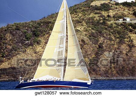 Stock Photo - A sailboat is seen participating in the Heiniken Regatta on St. Maarten.. Fotosearch