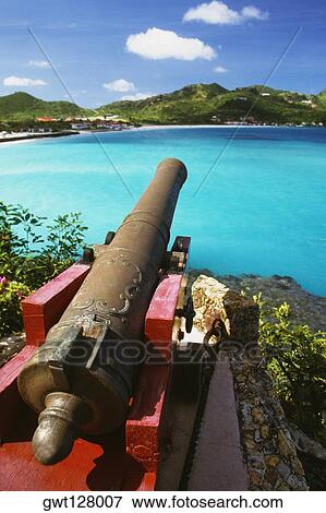 Stock Photo - An ornamental cannon near a seashore, St. Bant's. Fotosearch
