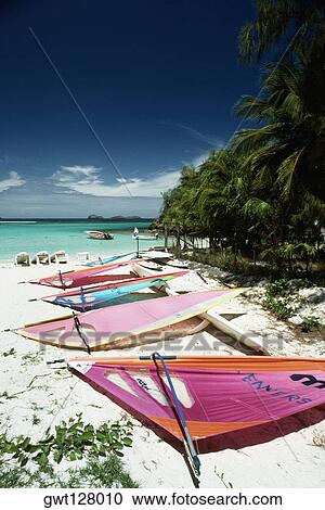 Colorful sails lying on a serene beach, St. Bant's View Large Photo Image Stock Image - Colorful sails lying on a serene beach, St. Bant's. Fotosearch