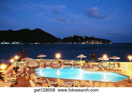 High angle view of a hotel swimming pool on the island of St. Martin at night. View Large Photo Image Stock Photo - High angle view of a hotel swimming pool on the island of St. Martin at night.. Fotosearch