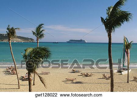 Large group of people are sunbathing on deck chairs, St. Martin, Leewards Islands, Caribbean View Large Photo Image Stock Image - Large group of people are sunbathing on deck chairs, St. Martin, Leewards Islands, Caribbean. Fotosearch
