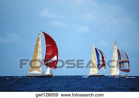 Sailboats participate in the Heiniken Regatta on the Dutch side of the island of St. Maarten in the Caribbean View Large Photo Image Stock Photo - Sailboats participate in the Heiniken Regatta on the Dutch side of the island of St. Maarten in the Caribbean. Fotosearch