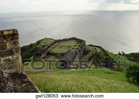 View of a lush meadow overlooking a vast sea, St. Kitts, Leeward Islands, Caribbean. View Large Photo Image Stock Image - View of a lush meadow overlooking a vast sea, St. Kitts, Leeward Islands, Caribbean.. Fotosearch