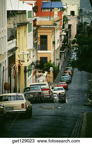 A queue of cars along the buildings, San Juan, Puerto Rico View Large Photo Image Stock Image - A queue of cars along the buildings, San Juan, Puerto Rico. Fotosearch
