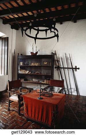 An antique chandelier is hung above a table in a room, Old San Juan, Puerto Rico View Large Photo Image Stock Image - An antique chandelier is hung above a table in a room, Old San Juan, Puerto Rico. Fotosearch