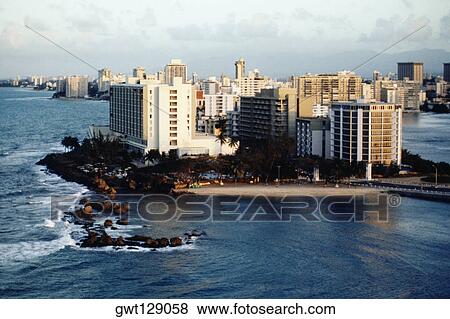 Stock Photo - Cityscape along the sea, Puerto Rico. Fotosearch