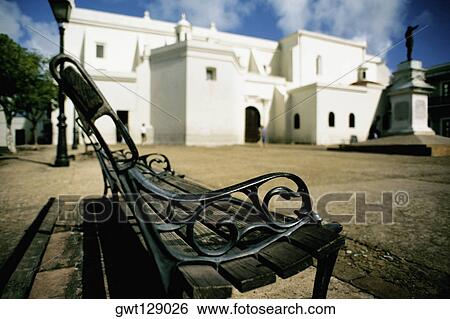 Side view of a bench with a white house at its back, San Juan, Puerto Rico View Large Photo Image Stock Photograph - Side view of a bench with a white house at its back, San Juan, Puerto Rico. Fotosearch