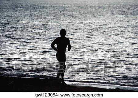 Silhouette of a man against the sea, Puerto Rico View Large Photo Image Picture - Silhouette of a man against the sea, Puerto Rico. Fotosearch
