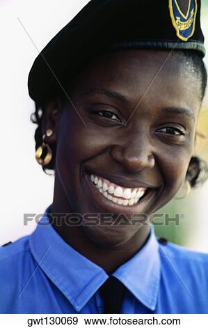 Stock Photo - Portrait of a security guard at the Hilton Hotel, Port of Spain, Trinidad. Fotosearch