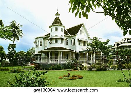 Side view of a stately mansion with a lawn in front of it, Trinidad View Large Photo Image Picture - Side view of a stately mansion with a lawn in front of it, Trinidad. Fotosearch
