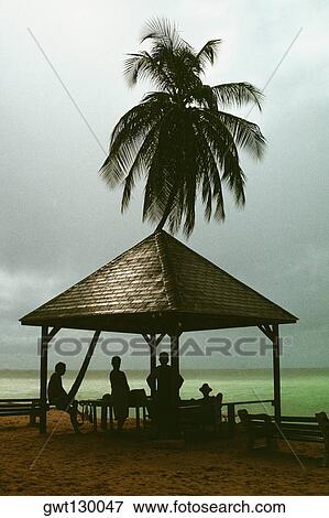 Stock Photo - View pf a picnic shelter beside the sea, Pigeon Point, Tobago, Caribbean. Fotosearch