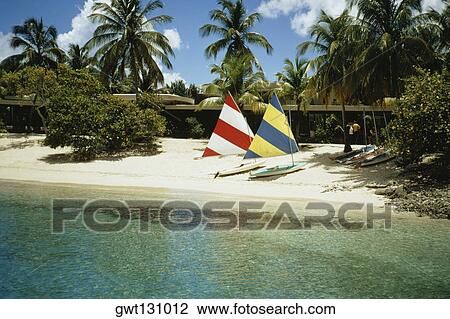 Stock Image - Sailboats on a beach, Caneel bay, U. S. Virgin Islands. Fotosearch