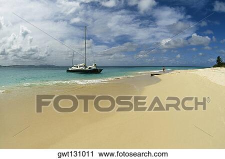 Side view of a boat along a beach, Buck Island, St. Croix, Virgin Islands View Large Photo Image Stock Image - Side view of a boat along a beach, Buck Island, St. Croix, Virgin Islands. Fotosearch