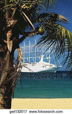 A boat is sailing on a calm sea, The Grenadines View Large Photo Image Stock Photo - A boat is sailing on a calm sea, The Grenadines. Fotosearch