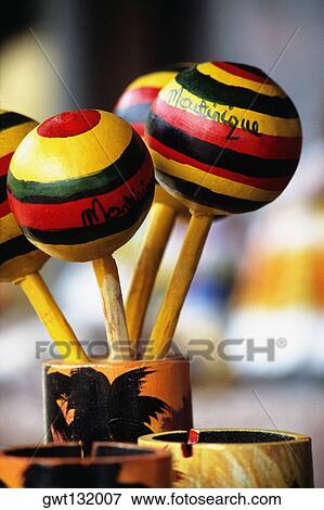 Colorful rattles are seen placed in a holder, Fort-de-France View Large Photo Image Stock Photo - Colorful rattles are seen placed in a holder, Fort-de-France. Fotosearch