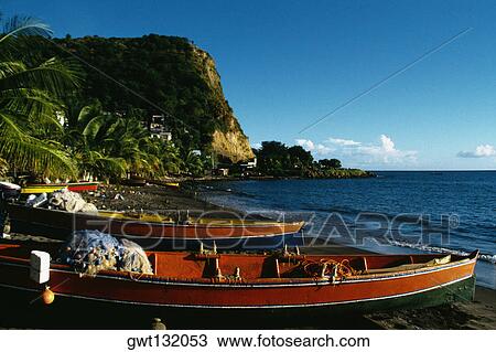 Fishing boats lined up on a seashore, Martinique, Caribbean View Large Photo Image Stock Image - Fishing boats lined up on a seashore, Martinique, Caribbean. Fotosearch