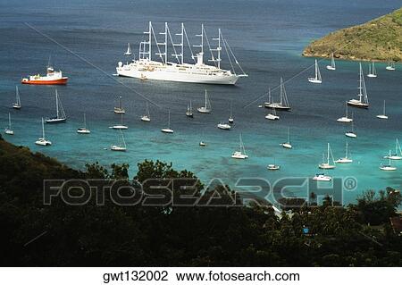 Scenic view of a large group of sailboats in the sea, The Grenadines View Large Photo Image Stock Image - Scenic view of a large group of sailboats in the sea, The Grenadines. Fotosearch